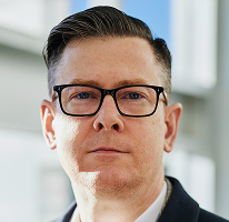暗号資産取引会社のエグゼクティブである Alexander Hughes CEO の肖像写真